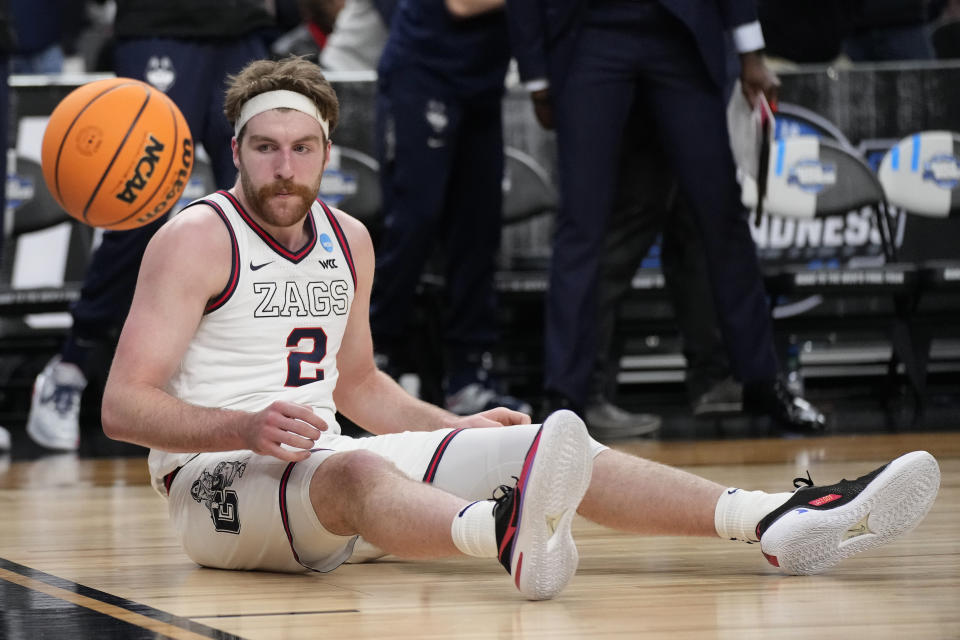 Gonzaga forward Drew Timme (2) sits on the floor after a play in the first half of an Elite 8 college basketball game against UConn in the West Region final of the NCAA Tournament, Saturday, March 25, 2023, in Las Vegas. (AP Photo/John Locher)
