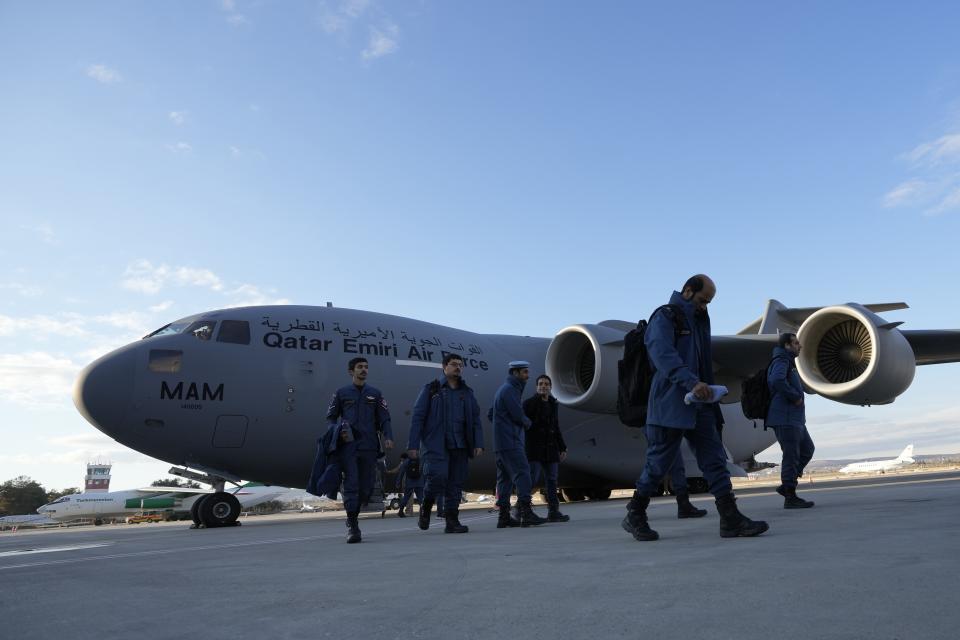 Qatari rescue and military personnel arrive at the Gaziantep Airport by Qatar Emiri AirForce as they brought supplies of assistance package to be sent for earthquake hit areas, in Gaziantep, southeastern Turkey, Tuesday, Feb 7, 2023. Search teams and international aid poured into Turkey and Syria on Tuesday as rescuers working in freezing temperatures and sometimes using their bare hands dug through the remains of buildings flattened by a powerful earthquake. (AP Photo/Kamran Jebreili)