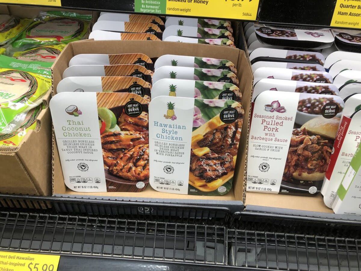 Four different kinds of meal kits including Hawaiian Style Chicken in the refrigerated section at Aldi, Texas City, Texas, tortillas on the left side