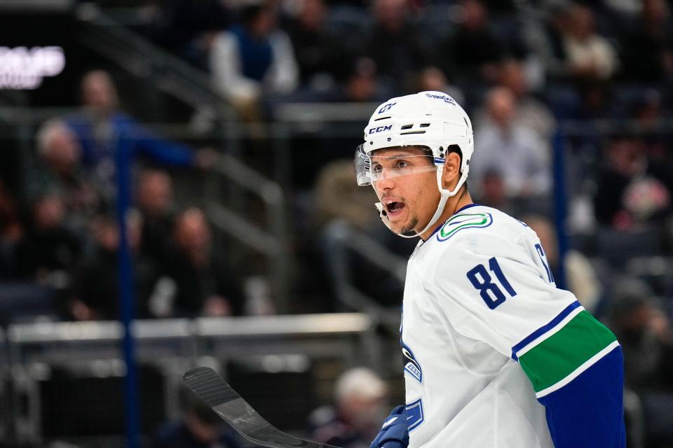 Oct 18, 2022; Columbus, Ohio, USA;  Vancouver Canucks forward Dakota Joshua (81) speaks with a teammate during the third period between the Columbus Blue Jackets and the Vancouver Canucks at Nationwide Arena. Mandatory Credit: Joseph Scheller-The Columbus Dispatch