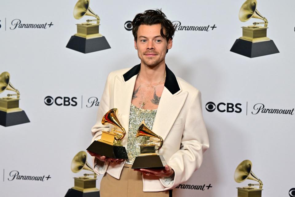 Harry Styles poses with the awards for Album Of The Year for 