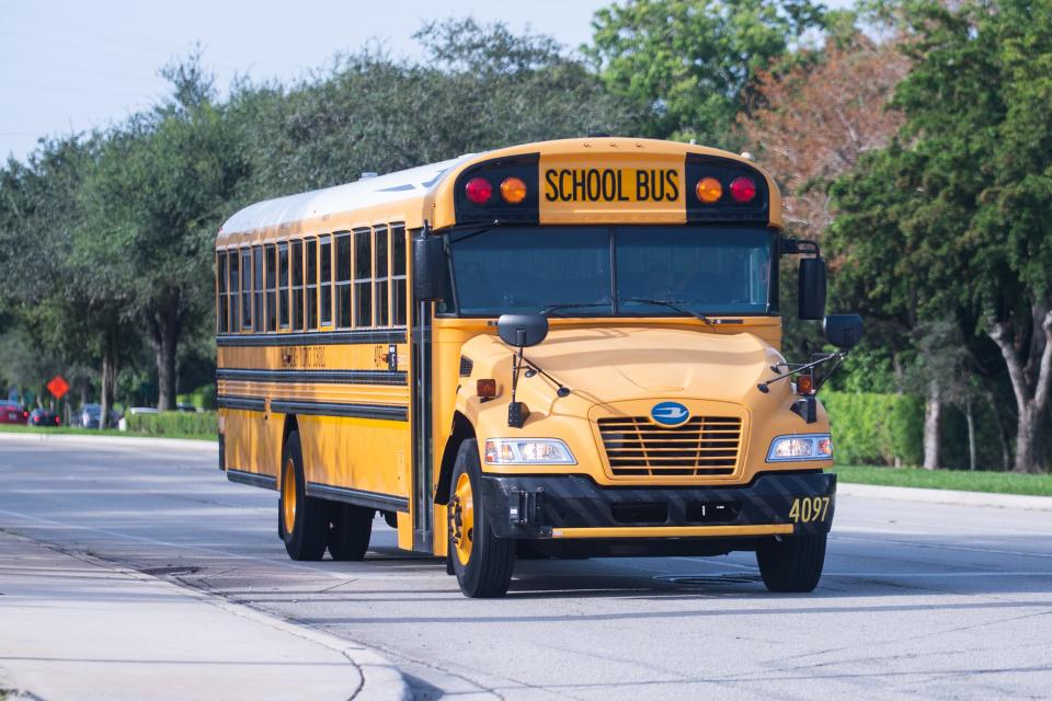 A school bus drives northbound on North Military Trail in Boca Raton during the first day of school on August 10, 2022. Earlier in the day another school bus was involved in a minor accident when it was rear end by a Chevrolet.