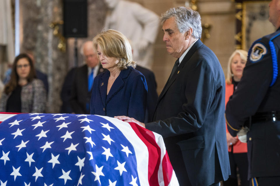 Sen. Lisa Murkowski, R-Alaska, with her husband Verne Martell, pay respects to the late Rep. Don Young, R-Alaska, in Statuary Hall as he lies in state on Capitol Hill in Washington, Tuesday, March 29, 2022. Young, the longest-serving member of Alaska's congressional delegation, died Friday, March 18. He was 88. (Shawn Thew/Pool Photo via AP)