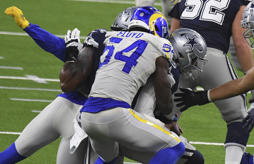 Outside linebacker Leonard Floyd (54) of the Los Angeles Rams sacks quarterback Dak Prescott (4) of the Dallas Cowboys in the fourth quarter during a NFL football game on opening night at SoFi Stadium in Inglewood on Sunday, September 13, 2020. Los Angeles Rams won 20-17. (Keith Birmingham/The Orange County Register via AP)