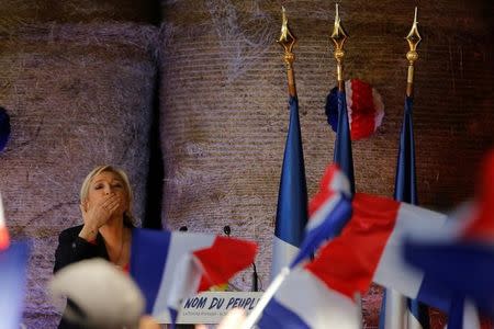 Marine Le Pen, French National Front (FN) political party leader and candidate for the 2017 French presidential election, attends a meeting in a farm in La Trinite-Porhoet, France March 30, 2017. REUTERS/Stephane Mahe/Files