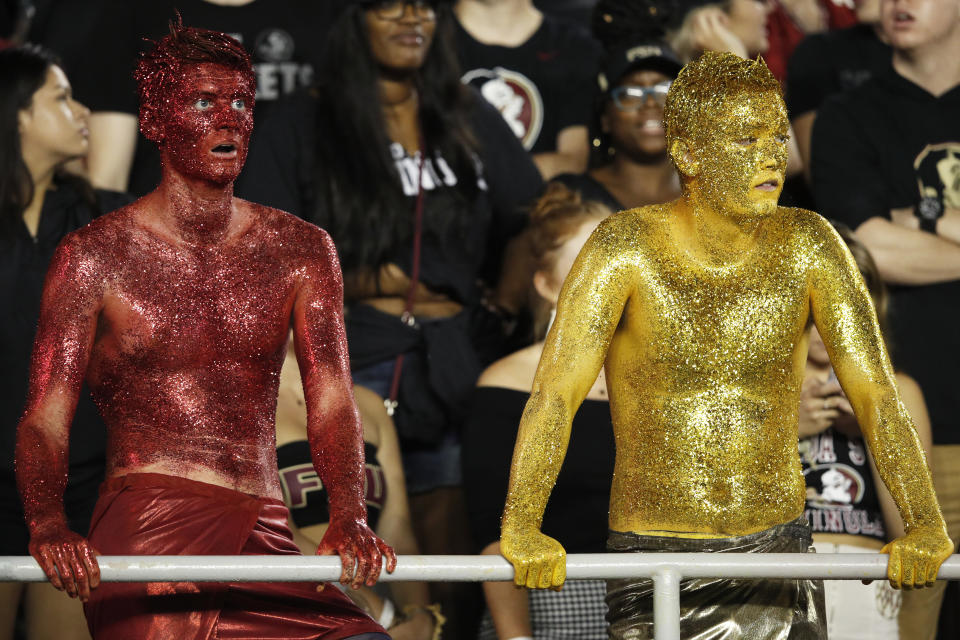 Imagine putting all this glitter on yourself, just to see Florida State lose. (Getty Images)