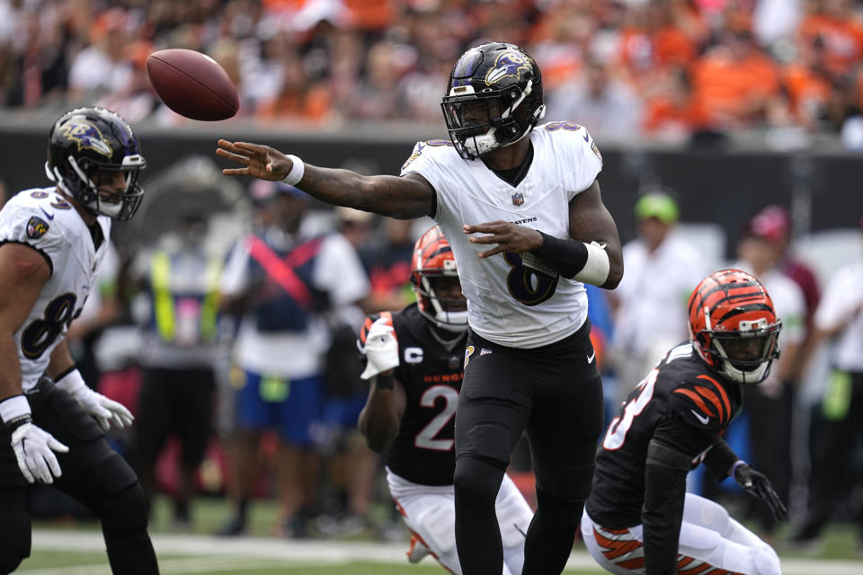 Baltimore Ravens quarterback Lamar Jackson tosses the ball during the first half of an NFL football game against the Cincinnati Bengals Sunday, Sept. 17, 2023, in Cincinnati. (AP Photo/Darron Cummings)