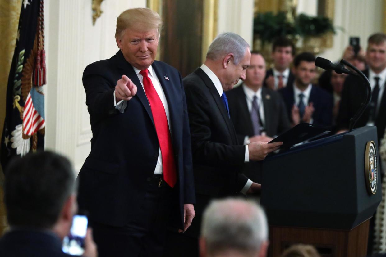 US President Donald Trump gestures during a press conference with Israeli Prime Minister Benjamin Netanyahu (C) in the East Room of the White House on January 28, 2020 in Washington, DC: Photo by Alex Wong/Getty Images