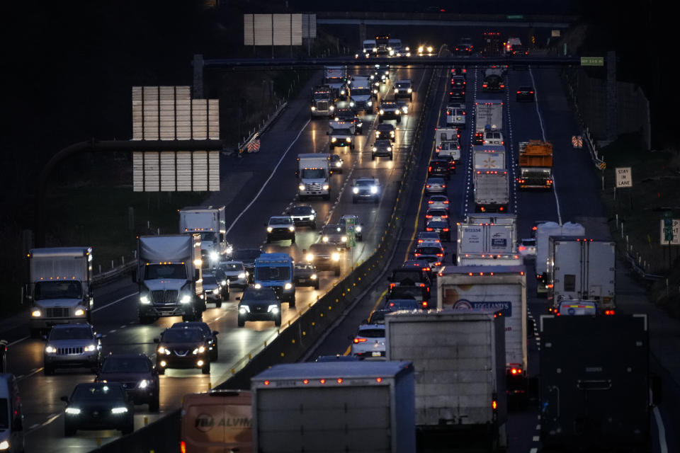 Motor vehicles move along Interstate 276 in Feasterville, Pa., Thursday, Dec. 21, 2023. (AP Photo/Matt Rourke)