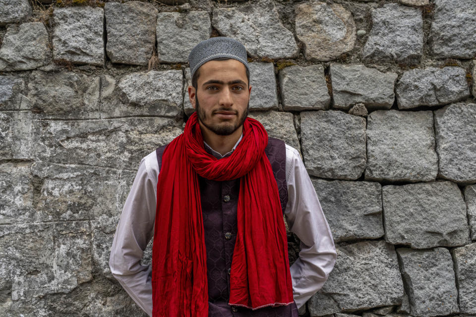 Zaffar Iqbal, a Kashmiri Nomadic devotee belonging to Gujjar tribe poses for a photograph outside the forest shrine of Sufi saint Mian Nizamuddin Kiyanwi in Baba Nagri, northeast of Srinagar, Indian controlled Kashmir, Saturday, June 8, 2024. Zaffar who along with his religious teacher is visiting for the first time said it feels great to be here and he intends to visit again in future. (AP Photo/Dar Yasin)