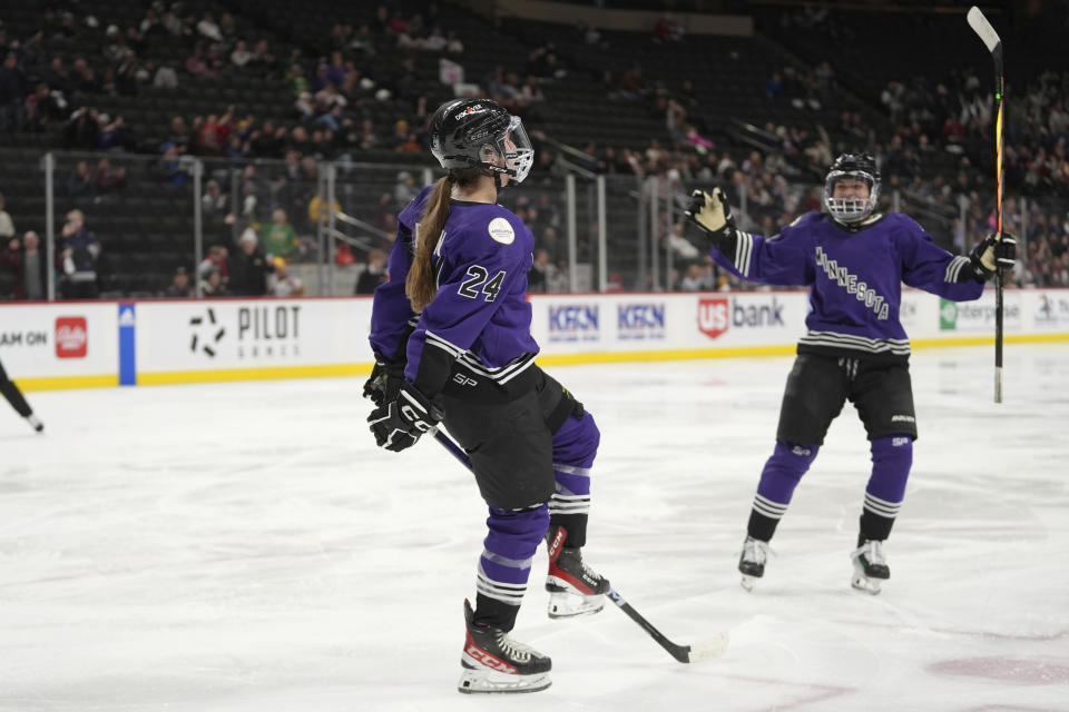 Minnesota forward Abby Boreen (24) celebrates next to defender Sophie Jaques after scoring against Ottawa during the second period of a PWHL hockey game Wednesday, Feb. 14, 2024, in St. Paul, Minn. (AP Photo/Abbie Parr)