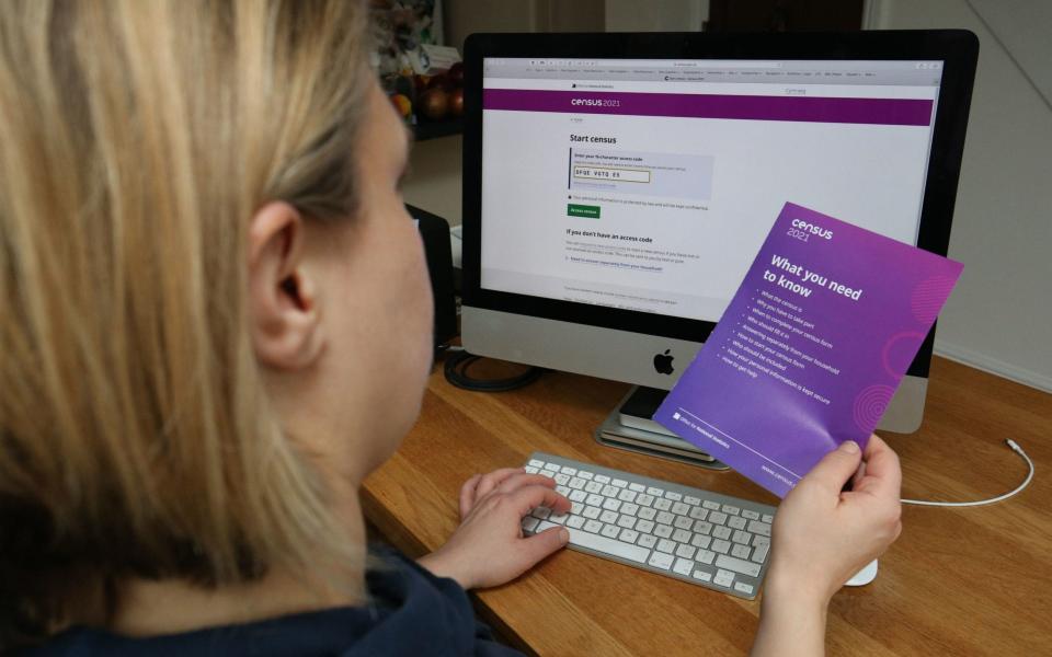 A woman completing their Census form on line ahead of Census Day  - Jonathan Brady/PA