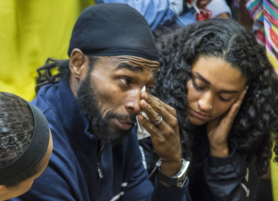 Clinton "C. J." Jones, brother of Corey Jones, wipes his eyes after Nouman Raja was sentenced to 25 years in prison in West Palm Beach on April 25, 2019. Raja, a former Palm Beach Gardens police officer, was convicted on one count each of manslaughter by culpable negligence and first-degree attempted murder. He shot and killed stranded motorist Corey Jones Oct. 18, 2015.  [LANNIS WATERS/palmbeachpost.com] POOL