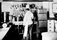 <p>A modern, electrically equipped kitchen aboard the zeppelin Hindenburg provides for the passengers and crew, seen in this undated photograph. The huge aircraft is scheduled to land the night of May 8, 1936, in Lakehurst, New Jersey, on the first of ten rounds between its home base in Germany and the United States. (AP Photo) </p>