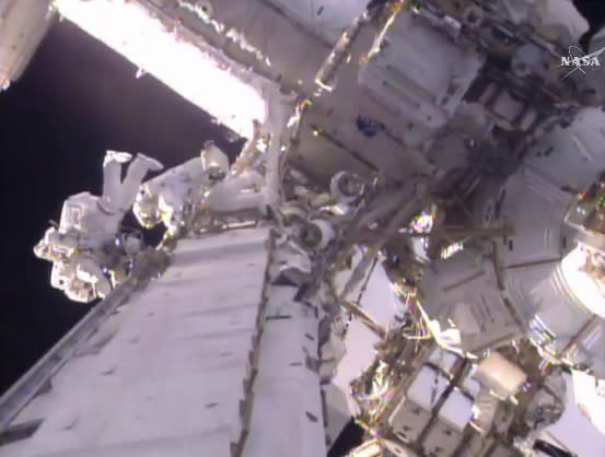 This still image taken from video provided by NASA shows U.S. astronaut Shane Kimbrough, left and French astronaut Thomas Pesquet during a space walk outside the International Space Station, Friday, Jan. 13, 2017. The astronauts are taking another spacewalk to plug in new and better batteries outside the space station. It's the same type of job conducted last Friday. Pesquet is the first French spacewalker in 15 years. (NASA via AP)