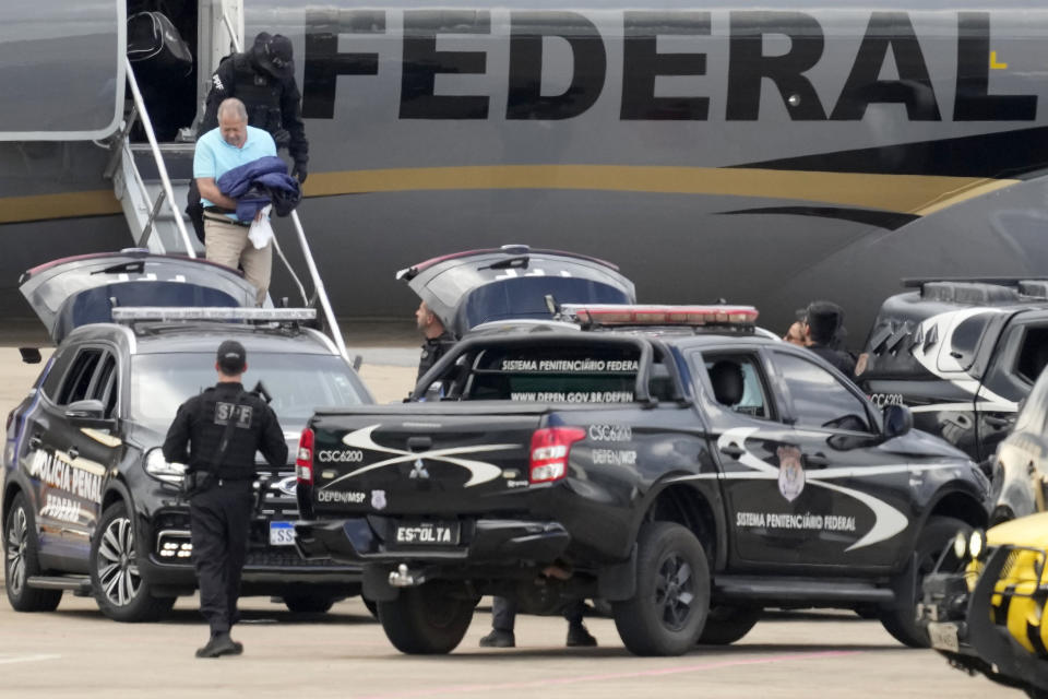 FILE - Federal legislator Chiquinho Brazao deplanes at the airport in Brasilia, Brazil, March 24, 2024. Brazao and his brother were detained on suspicion of ordering the killing of Rio de Janeiro councilwoman Marielle Franco. Both are allegedly connected to criminal groups, known as militias, which illegally charge residents for various services, including protection. (AP Photo/Eraldo Peres, File)