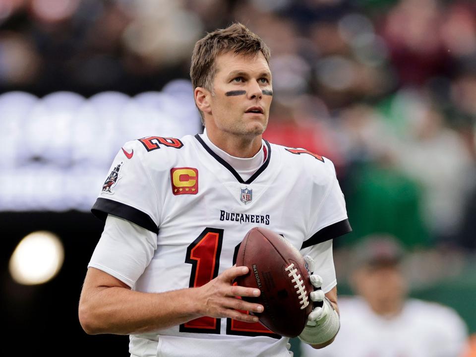 Tom Brady warms up for a game against the New York Jets.