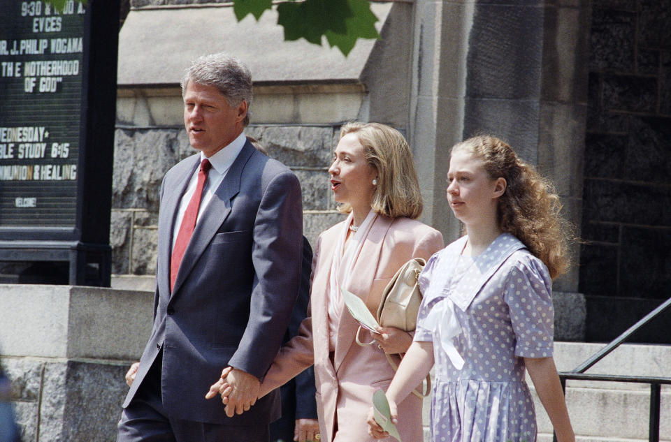 FILE - In this May 9, 1993 file photo, President Bill Clinton, first lady Hillary Rodham Clinton and daughter Chelsea leave the Foundry United Methodist Church in Washington. At Washington churches, presidents have long been seated in the pews. Bill and Hillary Clinton favored a Methodist church. Jimmy Carter taught Baptist Sunday School. And Barack Obama dropped in at an Episcopal church next to the White House. But as Easter Sunday approaches, President Donald Trump has not attended a church service in the Capitol since the worship events during his inauguration weekend. (AP Photo/Dennis Cook, File)
