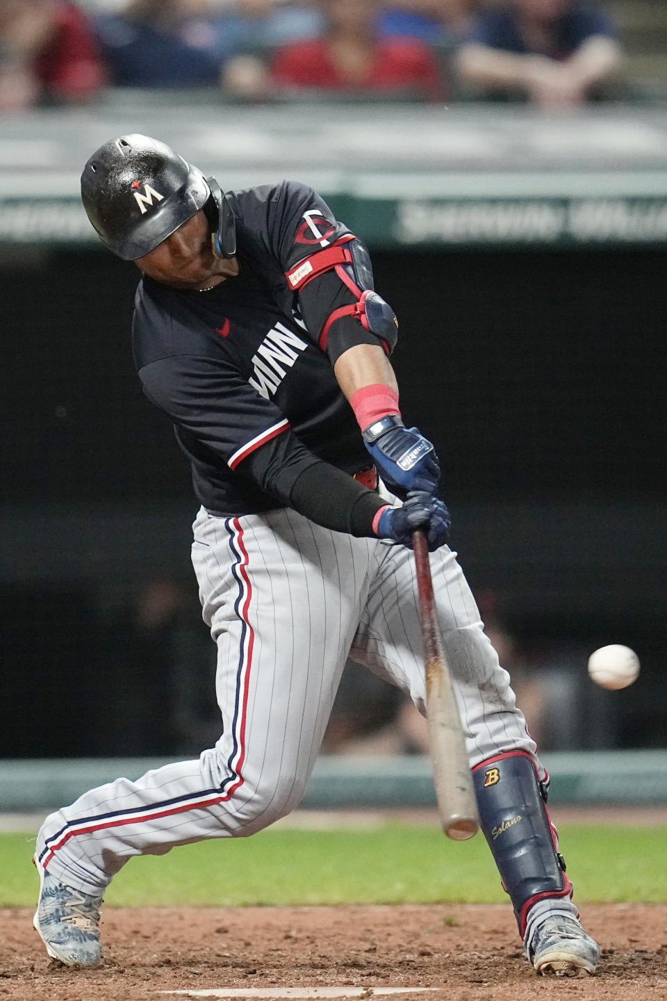 Minnesota Twins' Donovan Solano hits a triple in the eighth inning of a baseball game against the Cleveland Guardians, Tuesday, Sept. 5, 2023, in Cleveland. (AP Photo/Sue Ogrocki)