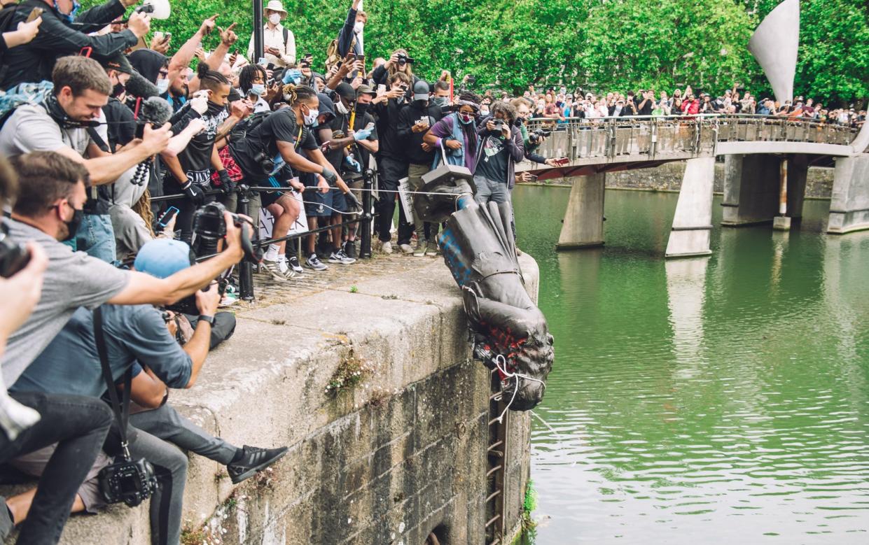 Protestors push the statue of Edward Colston into the River Avon in 2020