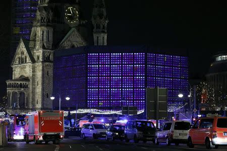 Police stand near the Christmas market in Berlin, Germany December 19, 2016. REUTERS/Pawel Kopczynski