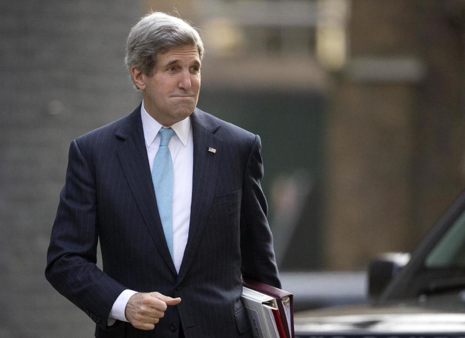 US Secretary of State John Kerry arrives for a meeting with Britain's Prime Minister David Cameron and the Foreign Secretary William Hague at Downing street in London, Friday, March, 14, 2014. Kerry arrived in London Friday, for his last meeting with Russian Foreign Minister Sergey Lavrov before the Crimea vote. (AP Photo/Alastair Grant)