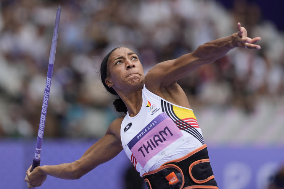 Belgium's Nafissatou Thiam makes history by winning third a third