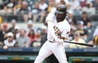 May 16, 2018; Pittsburgh, PA, USA; Pittsburgh Pirates pinch hitter Josh Bell (55) hits an RBI single against the Chicago White Sox during the seventh inning at PNC Park. Mandatory Credit: Charles LeClaire-USA TODAY Sports