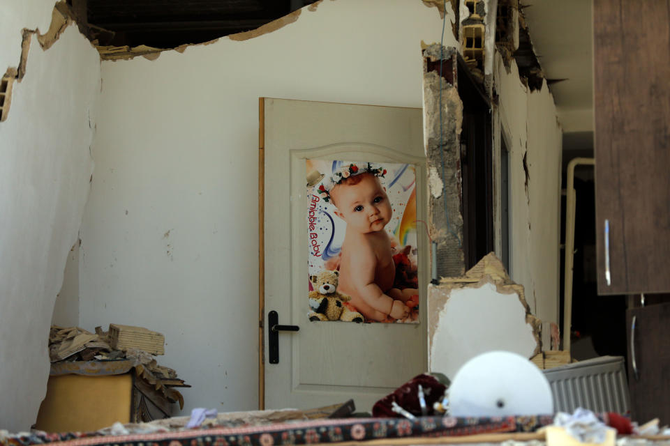 <p>A picture of a baby is seen on a room door after an earthquake in the city of Pole-Zahab in Kermanshah Province, Iran, Nov. 13, 2017. (Photo: Abedin Taherkenareh/EPA-EFE/REX/Shutterstock) </p>