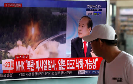 A man watches a TV broadcast of a news report on North Korea's ballistic missile test, at a railway station in Seoul, South Korea, July 4, 2017. REUTERS/Kim Hong-Ji