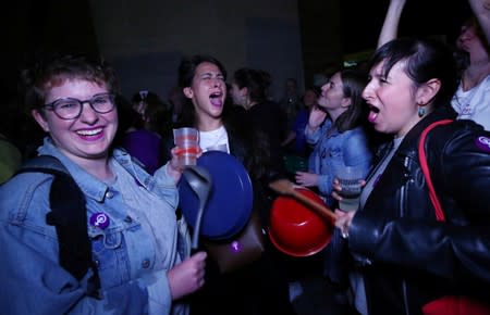 Women bang kitchen pots and pans at the start of a women's strike in Lausanne