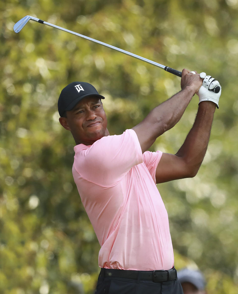 Tiger Woods tees off on the third hole during the first round of the Tour Championship golf tournament at East Lake Golf Club, in Atlanta, Thursday, Sept. 20, 2018. (Curtis Compton/Atlanta Journal-Constitution via AP)