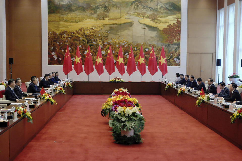 Chinese President Xi Jinping, left, and Vietnamese Chairman of the National Assembly Vuong Dinh Hue, right, attend a meeting at the National Assembly in Hanoi, Vietnam, Wednesday, Dec. 13, 2023. (AP Photo/Minh Hoang, Pool)