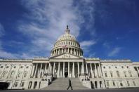 FILE PHOTO: A man walks past the U.S. Capitol in Washington