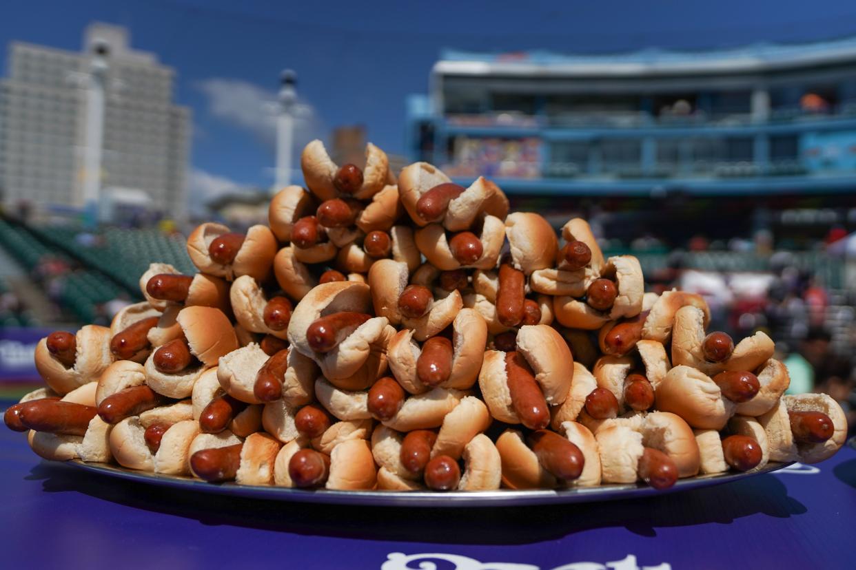 Hot dogs are prepared for the 2021 Nathan's Famous 4th Of July International Hot Dog Eating Contest on July 4, 2021, in New York City.