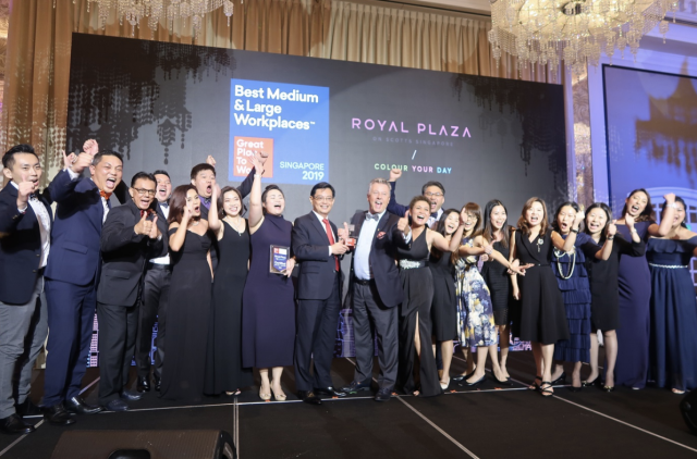 CEO Patrick Fiat with hotel talents receiving the award  from Guest of Honour, Mr Heng Swee Keat, Deputy Prime Minister. (PHOTO: Royal Plaza on Scotts)