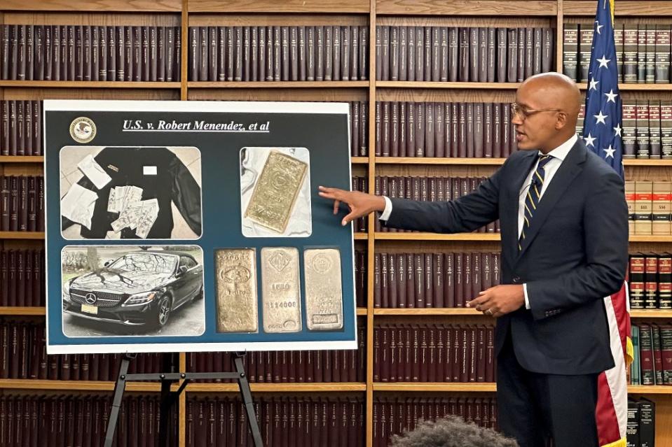US Attorney Damian Williams shows photos of some of the alleged bribes that the feds say Menendez received. AP