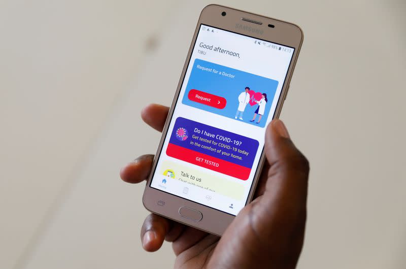 A man displays the TIBU Health app of the Nairobi-based startup on his phone in Nairobi