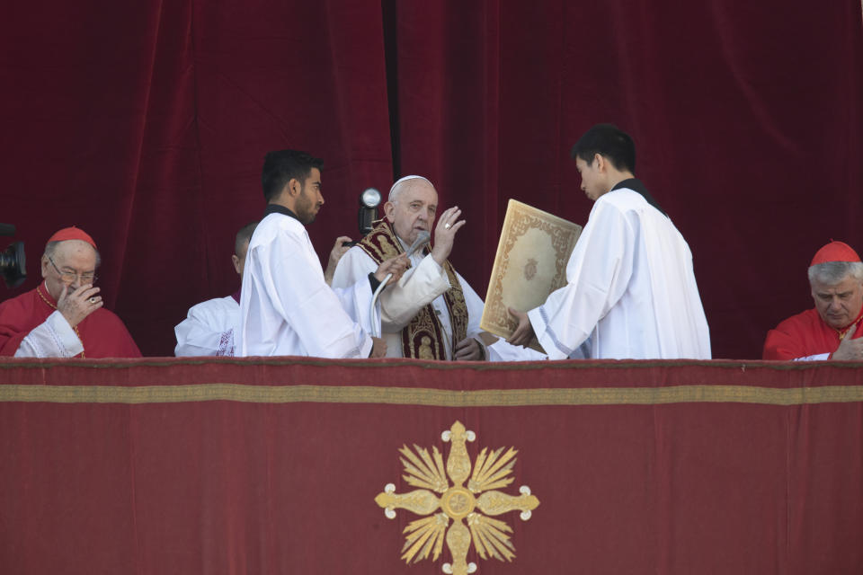 Pope Francis delivers the Urbi et Orbi (Latin for 'to the city and to the world' ) Christmas' day blessing from the main balcony of St. Peter's Basilica at the Vatican, Wednesday, Dec. 25, 2019. (AP Photo/Alessandra Tarantino)
