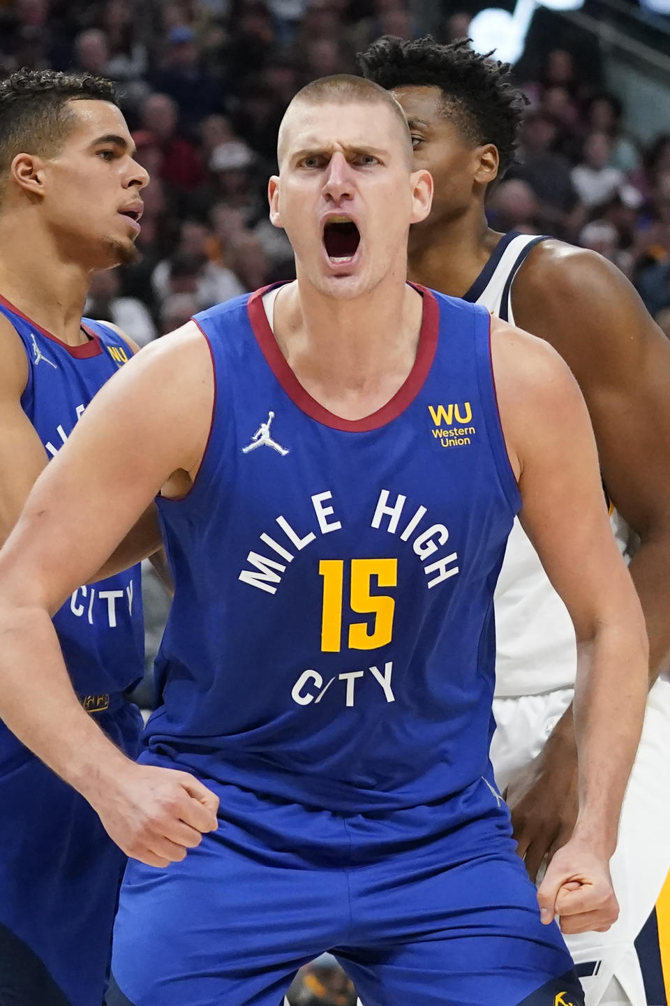 Denver Nuggets center Nikola Jokic (15) reacts after a non-call in the first half during an NBA basketball game against the Utah Jazz Tuesday, Oct. 26, 2021, in Salt Lake City. (AP Photo/Rick Bowmer)