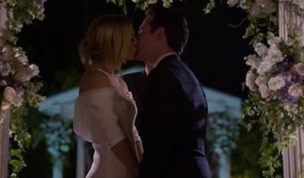 JJ and will kissing at the alter