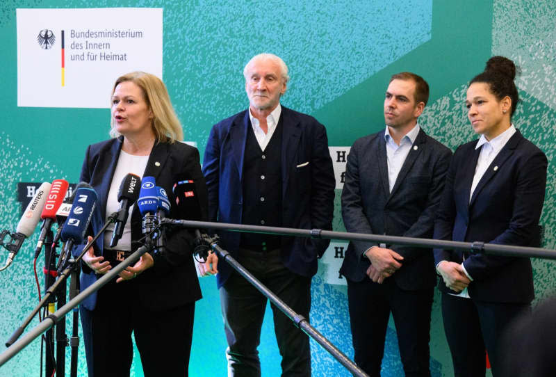 (L-R) Nancy Faeser, German Minister of the Interior and Home Affairs, DFP Sports Director Rudi Voeller, Tournament Director Philipp Lahm and Tournament Ambassador Celia Sasic speak at a 100-day countdown event for UEFA EURO 2024 at the Federal Ministry of the Interior and Home Affairs. Bernd von Jutrczenka/dpa