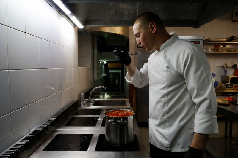 Ukrainian chef Marshal tastes borshch at a traditional cuisine restaurant in Kyiv