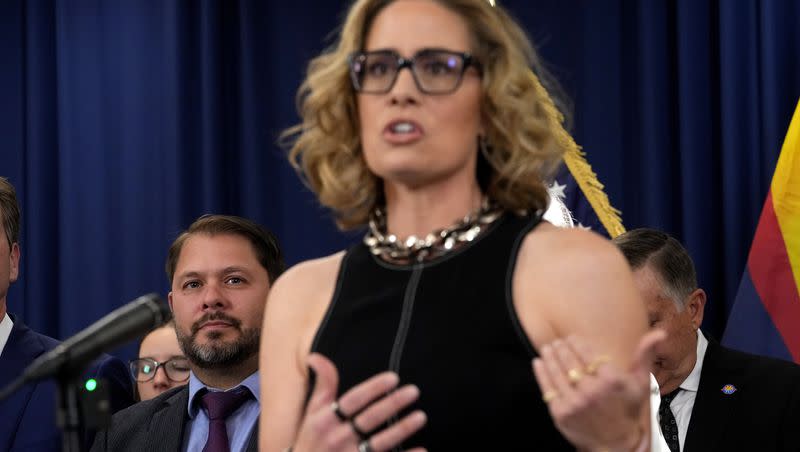 U.S. Rep. Ruben Gallego, D-Ariz., left, listens as U.S. Sen. Kyrsten Sinema, I-Ariz., speaks at the Capitol, Thursday, April 6, 2023, in Phoenix. Gallego is expected to challenge Sinema for her Senate seat in the next election.