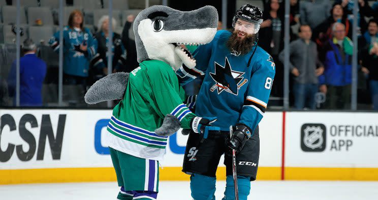 SAN JOSE, CA - JANUARY 7: Mascot, SJ Sharkie and Brent Burns #88 of the San Jose Sharks celebrate the win after a NHL game against the Detroit Red Wings at SAP Center at San Jose on January 7, 2017 in San Jose, California. The Sharks defeated the Red Wings 6-3. (Photo by Don Smith/NHLI via Getty Images)