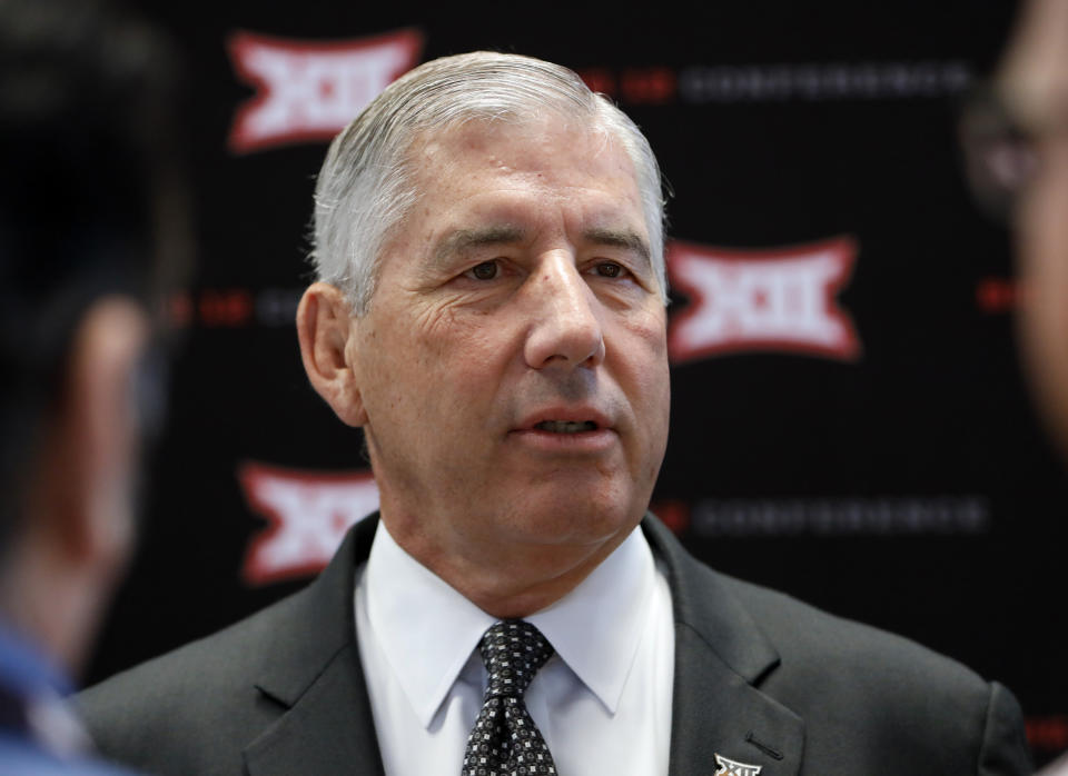 Conference commissioner Bob Bowlsby answers questions from reporters after his opening remarks on the first day of Big 12 Conference NCAA college football media days Monday, July 15, 2019, at AT&T Stadium in Arlington, Texas. (AP Photo/David Kent)