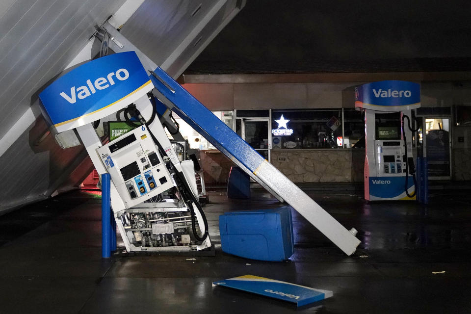 The canopy of gas station, toppled by strong winds, rests at an angle, Wednesday, Jan. 4, 2023,  in south San Francisco. Another winter storm moved into California on Wednesday, walloping the northern part of the state with more rain and snow. It's the second major storm of the week in the parched state. It follows storms that brought threats of flash flooding and severe thunderstorms across the southern U.S. and heavy snow in the upper Midwest. (Godofredo A. Vásquez / AP)