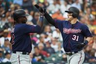 Aug 11, 2018; Detroit, MI, USA; Minnesota Twins designated hitter Tyler Austin (31) receives congratulations from third baseman Miguel Sano (22) after he hits a two run home run in the fifth inning against the Detroit Tigers at Comerica Park. Mandatory Credit: Rick Osentoski-USA TODAY Sports