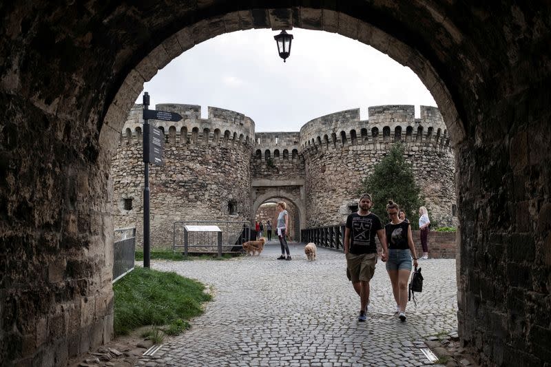 FILE PHOTO: People walk at the Kalemegdan fortress in Belgrade, Serbia