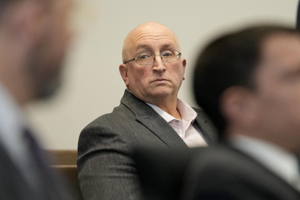 Robert E. Crimo Jr., father of Robert Crimo III, waits for court to begin before Judge George D. Strickland at the Lake County, Ill., Courthouse Thursday, Jan. 26, 2023, in Waukegan, Ill. Crimo Jr., faces seven counts of felony reckless conduct for signing the application for his son's firearm owners ID card in December of 2019. (AP Photo/Nam Y. Huh, Pool)